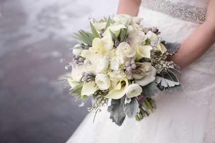 Bride Holding a Bouquet of Flowers