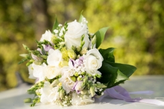 Wedding bouquet with white roses on green nature background